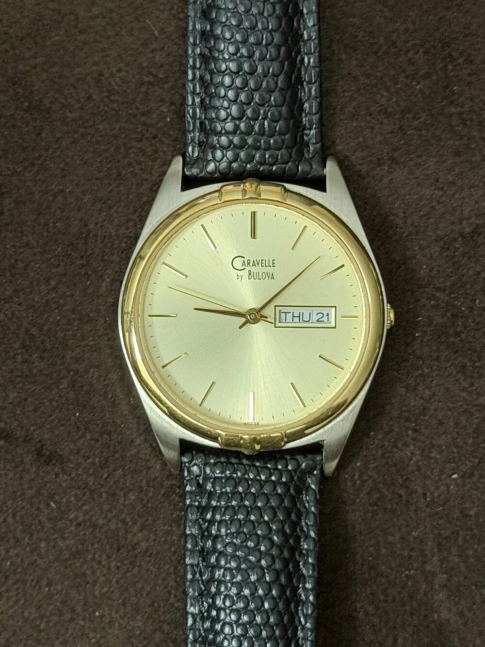 Caravelle by Bulova Quartz Analog Watch Gold Dial Day/Date Black Leather